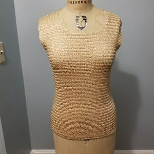 Form fitting gold blouse.